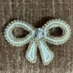 Elegant Pearl & Crystal Bow Brooch